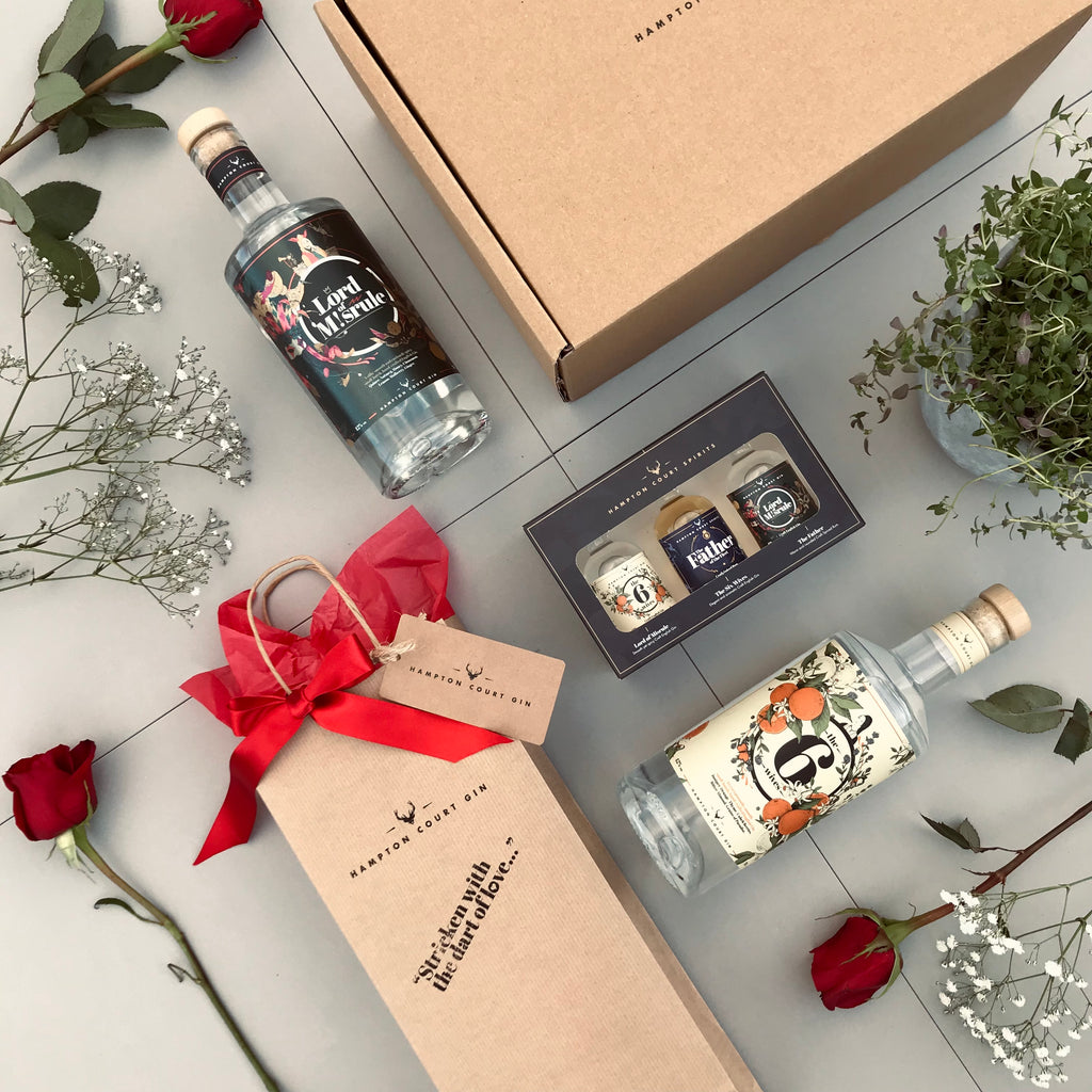 Hampton Court Spirits flatlay of products styled with flowers for Valentine's Day 